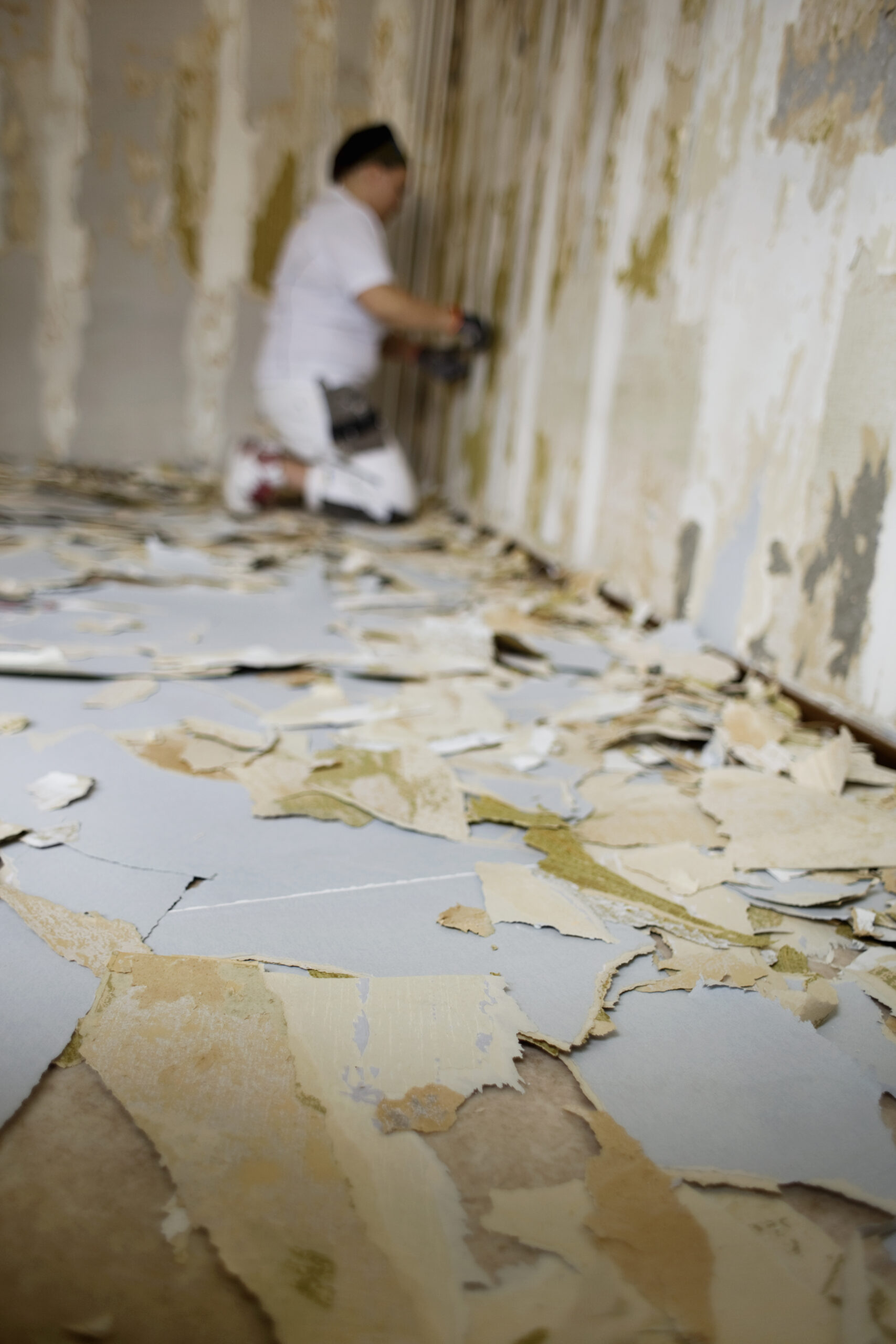 Side view of painter working at site